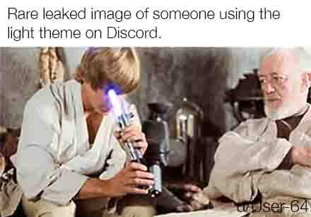 A meme of Luke Skywalker turning on his lightsaber while it points into his face, mocking light theme.