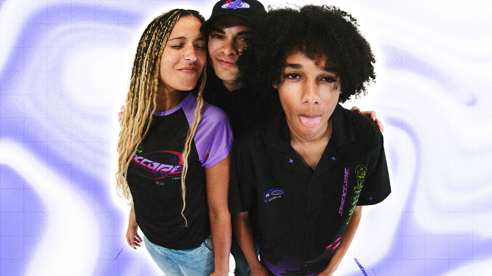 Three friends wearing DISXCORE-themed merchandise.